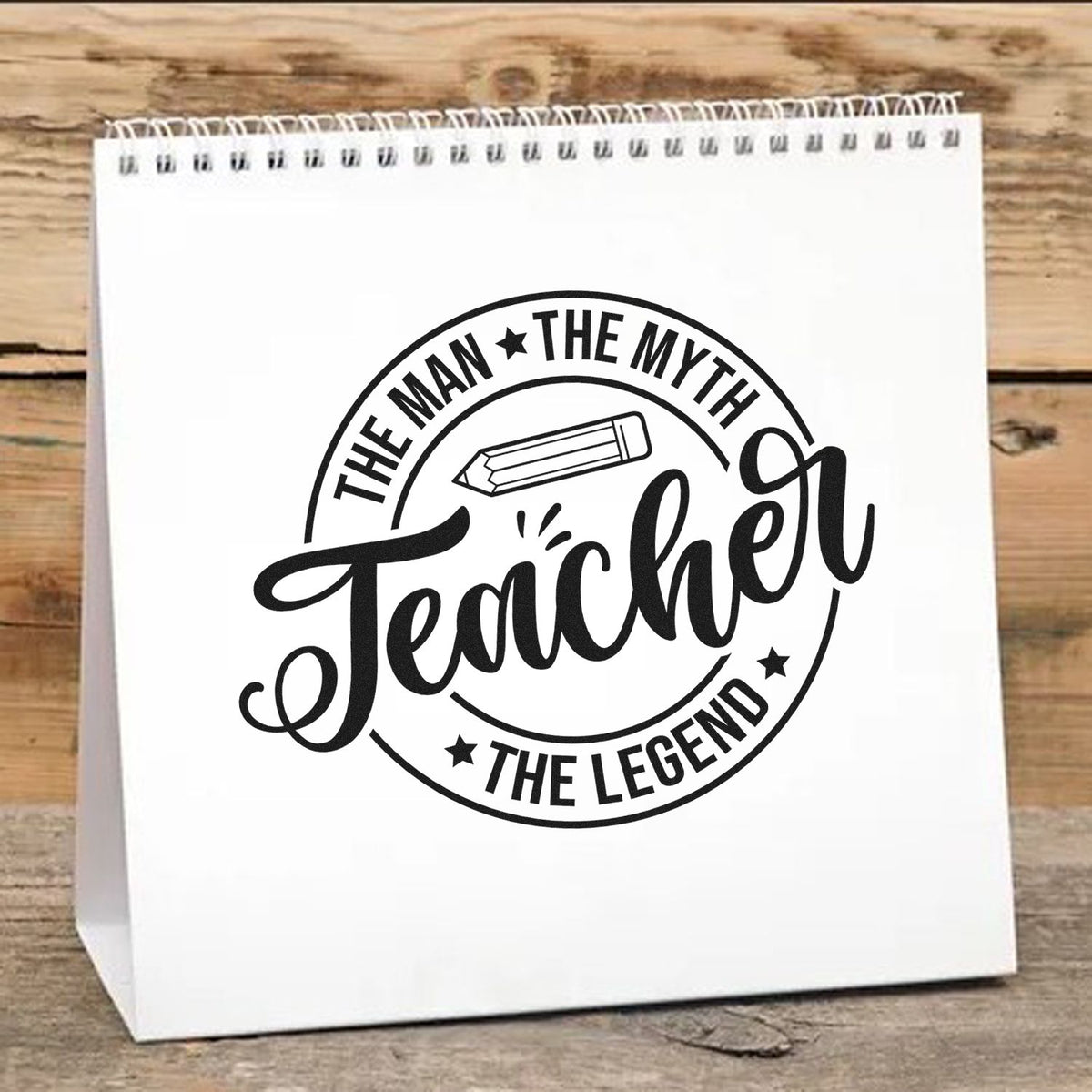 Teacher rubber stamp design on white gift bag with pencil icon and The Man, The Myth, The Teacher, The Legend text.