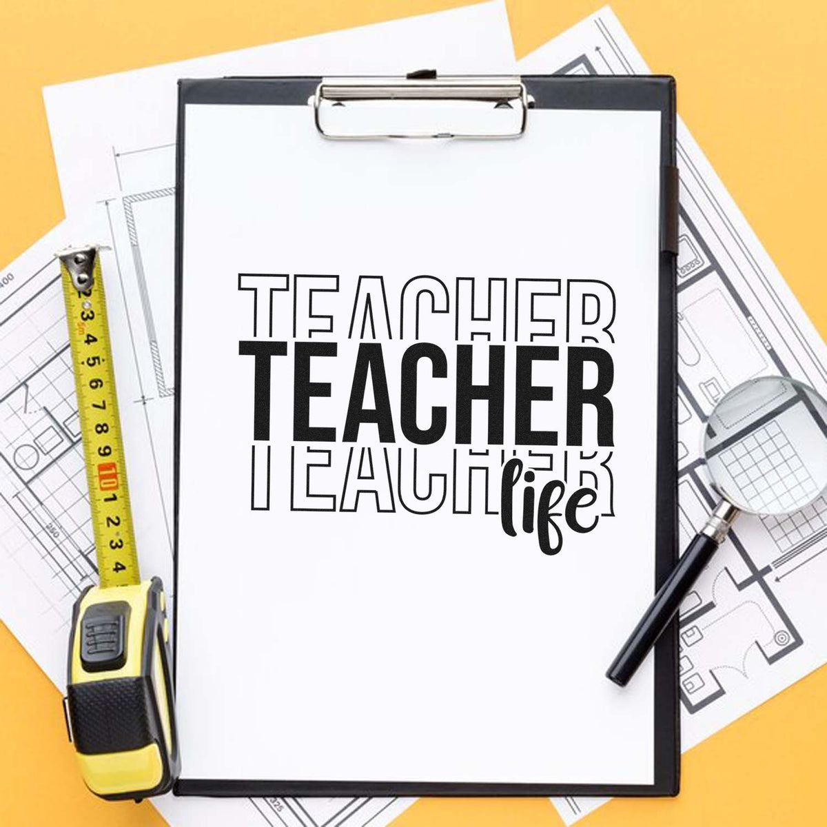 Teacher rubber stamp design on clipboard with measuring tape and blueprints, ideal for classroom crafts and educator gifts.