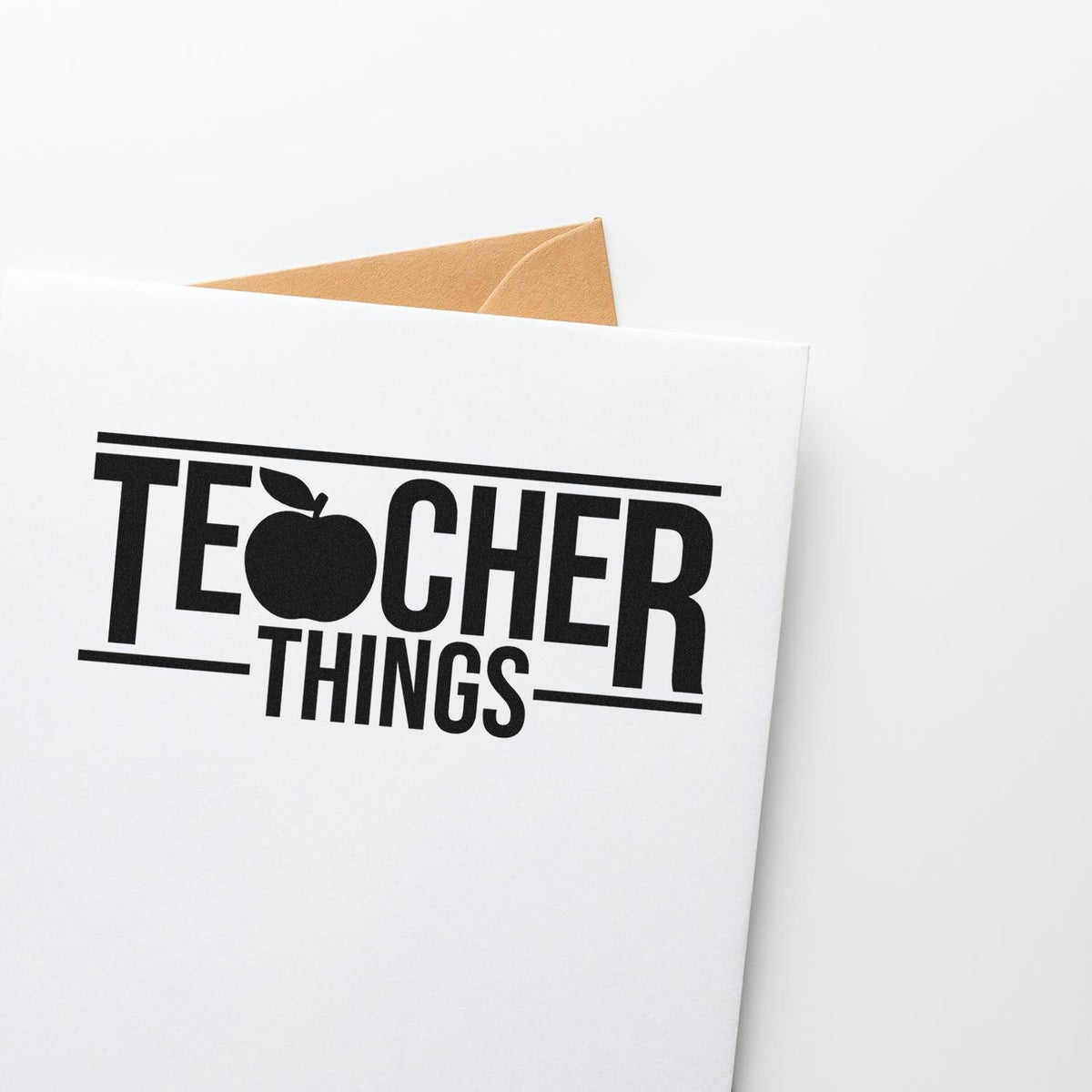 Teacher Things rubber stamp design on a white envelope for teacher gifts, classroom branding, and custom stationery.