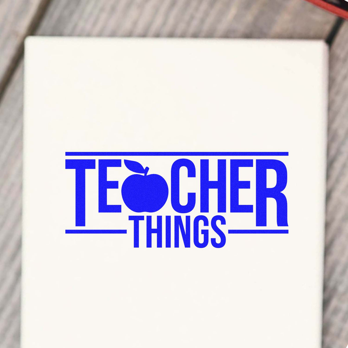 Teacher Things rubber stamp design with apple icon, perfect for classroom grading, teacher gifts, and school craft projects.