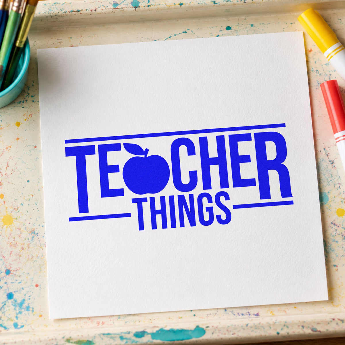 Teacher Things craft stamp in blue ink on cardstock, an easy option for zip pouch panels.