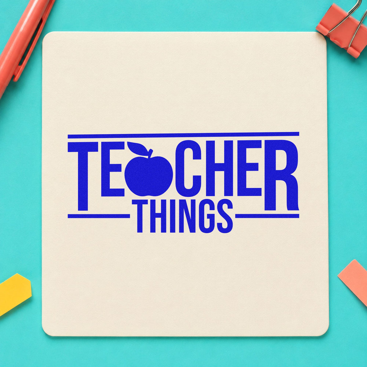 Teacher Things craft stamp imprinted in blue ink on paper, a design suited to cubby tag labels.