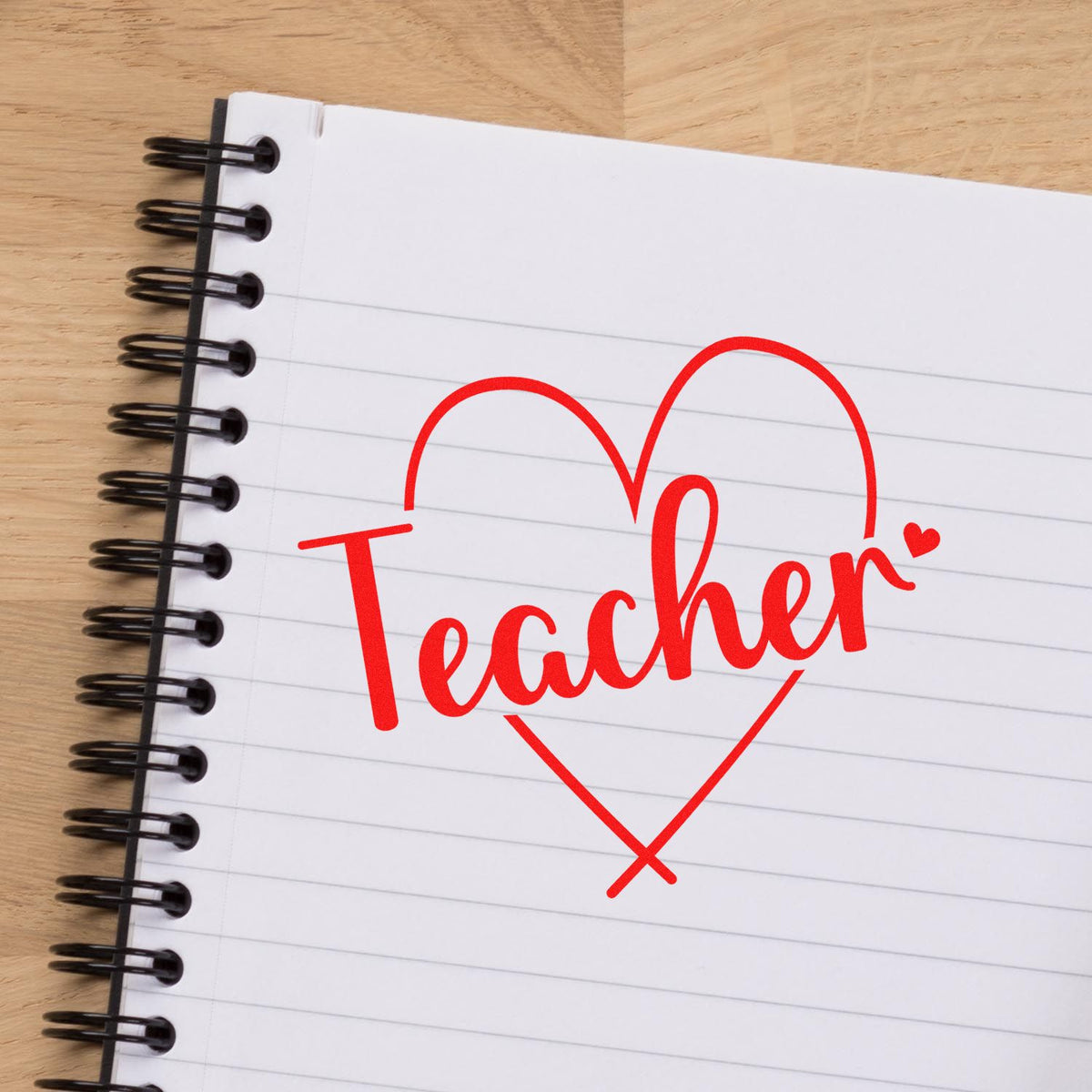 Teacher rubber stamp design in red heart on notebook paper, ideal for teacher appreciation, classroom crafts, and custom stamps.