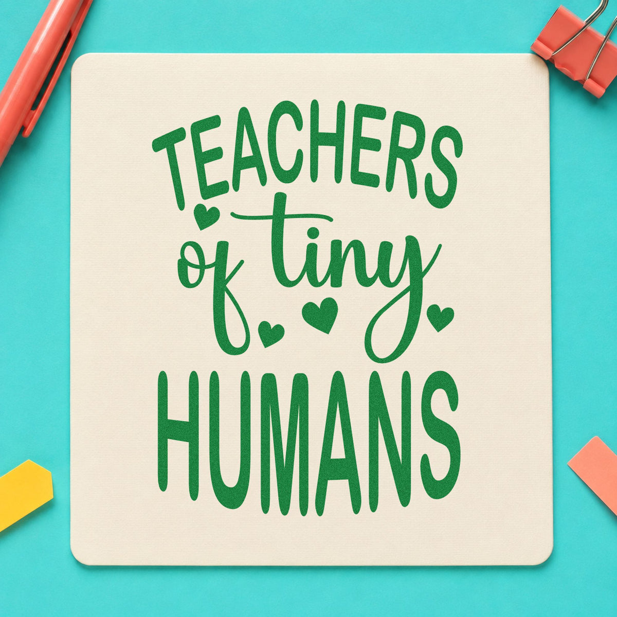Teachers of Tiny Humans craft stamp imprint in green ink on a handmade project, one idea being growth chart pages.