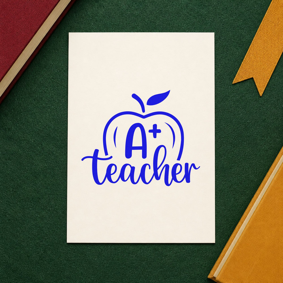A Plus Teacher Apple craft stamp in blue ink on cardstock, an easy option for marking pen panels.