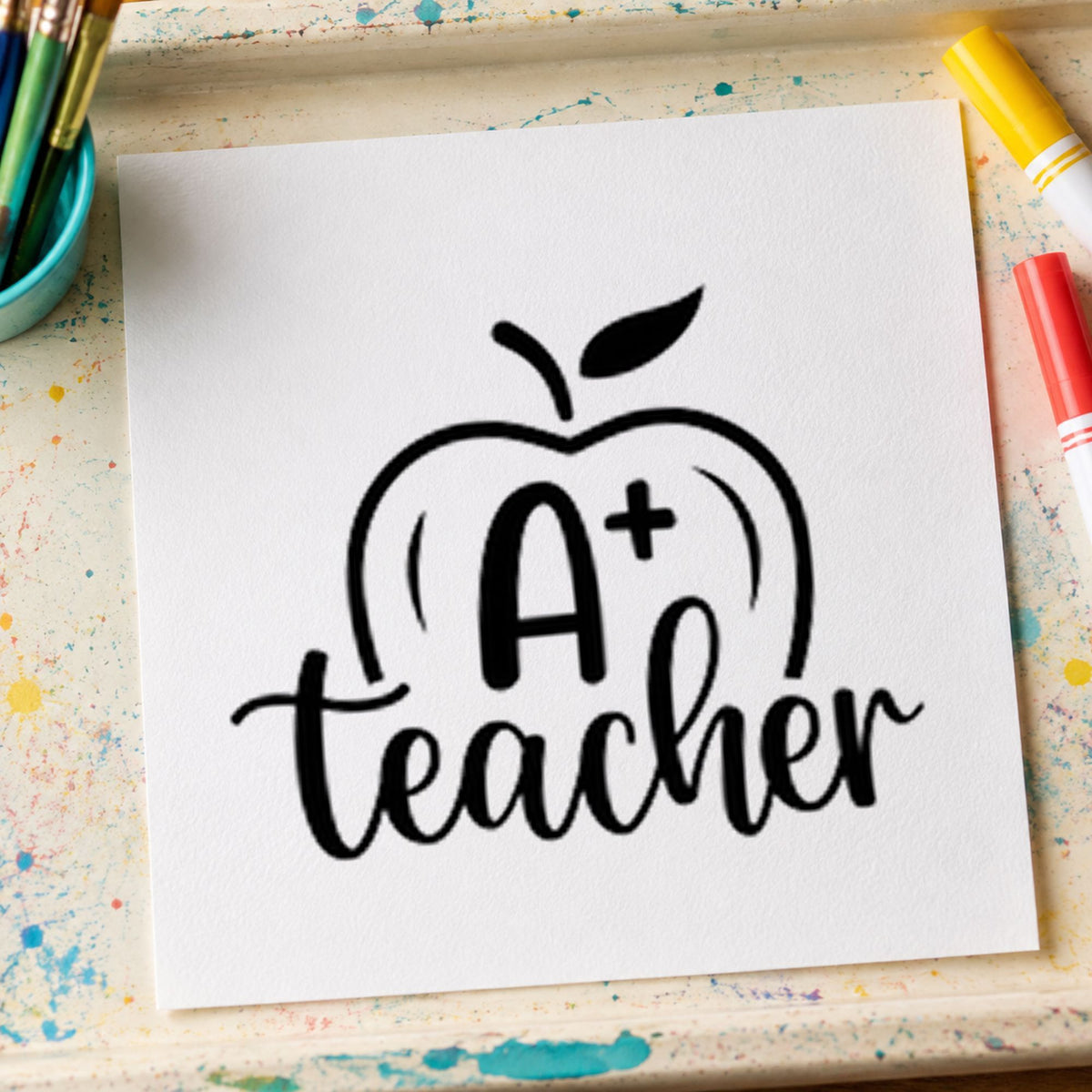 A Plus Teacher Apple rubber stamp printed in black ink, ready for apple grade cards and similar paper crafts.