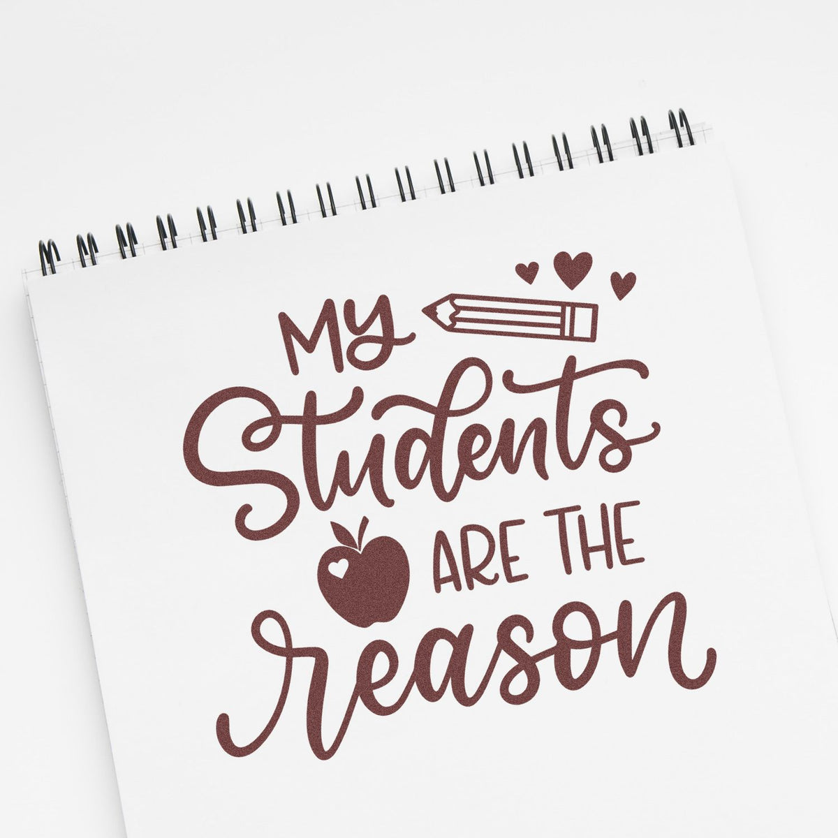 Teacher rubber stamp design reading My Students Are the Reason with pencil and hearts for classroom stationery and gifts.