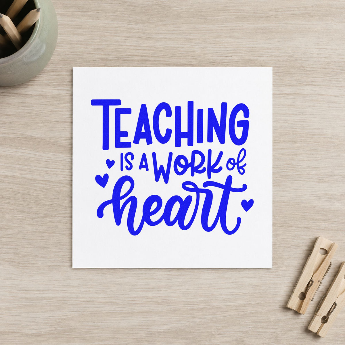 Teaching Work of Heart craft stamp in blue ink on cardstock, an easy option for bench cushion panels.