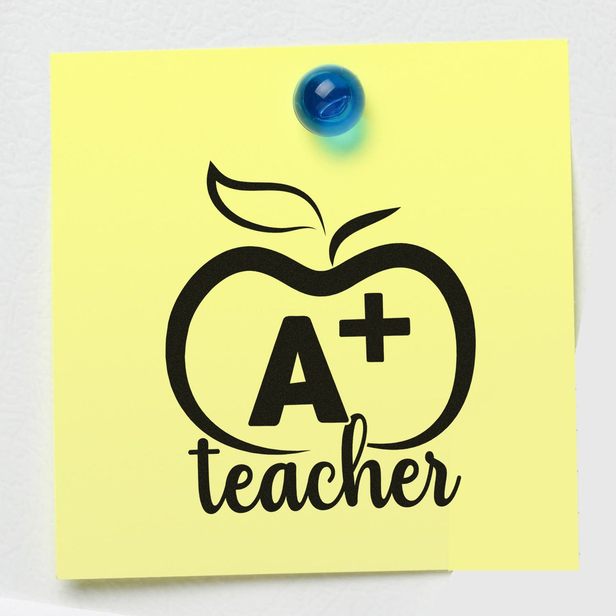 A+ teacher rubber stamp design on a yellow sticky note with apple icon, ideal for classroom grading and teacher supplies.