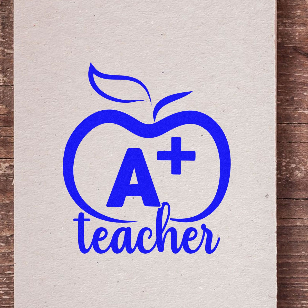 A+ teacher rubber stamp design with apple icon, perfect for classroom rewards, grading, and teacher appreciation projects.