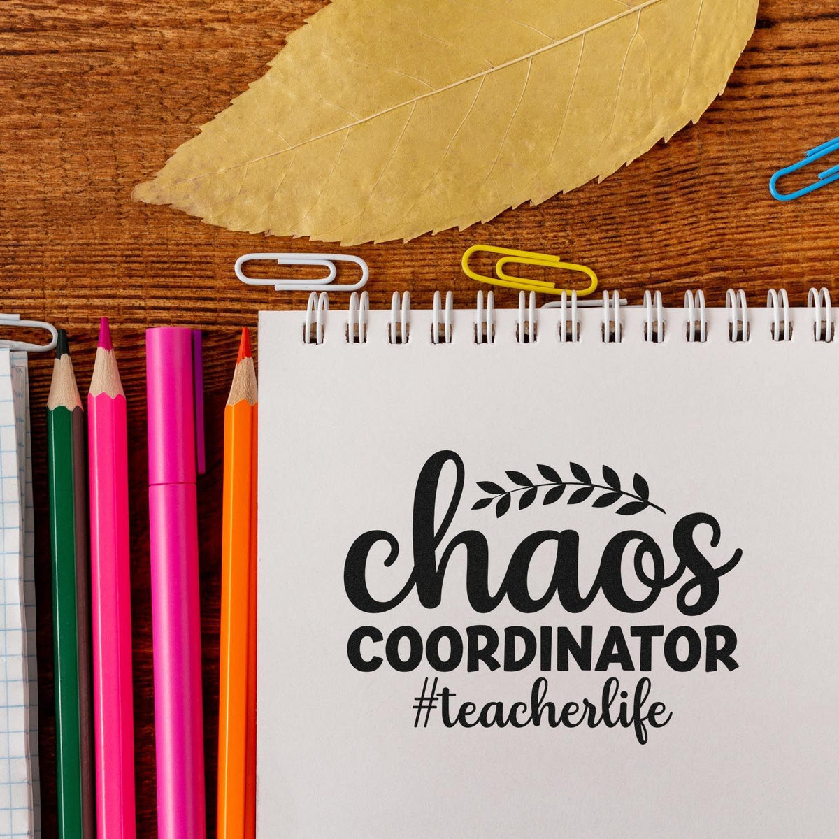 Chaos Coordinator #teacherlife rubber stamp design on notebook, perfect for teacher gifts, classroom planning, and DIY stationery.