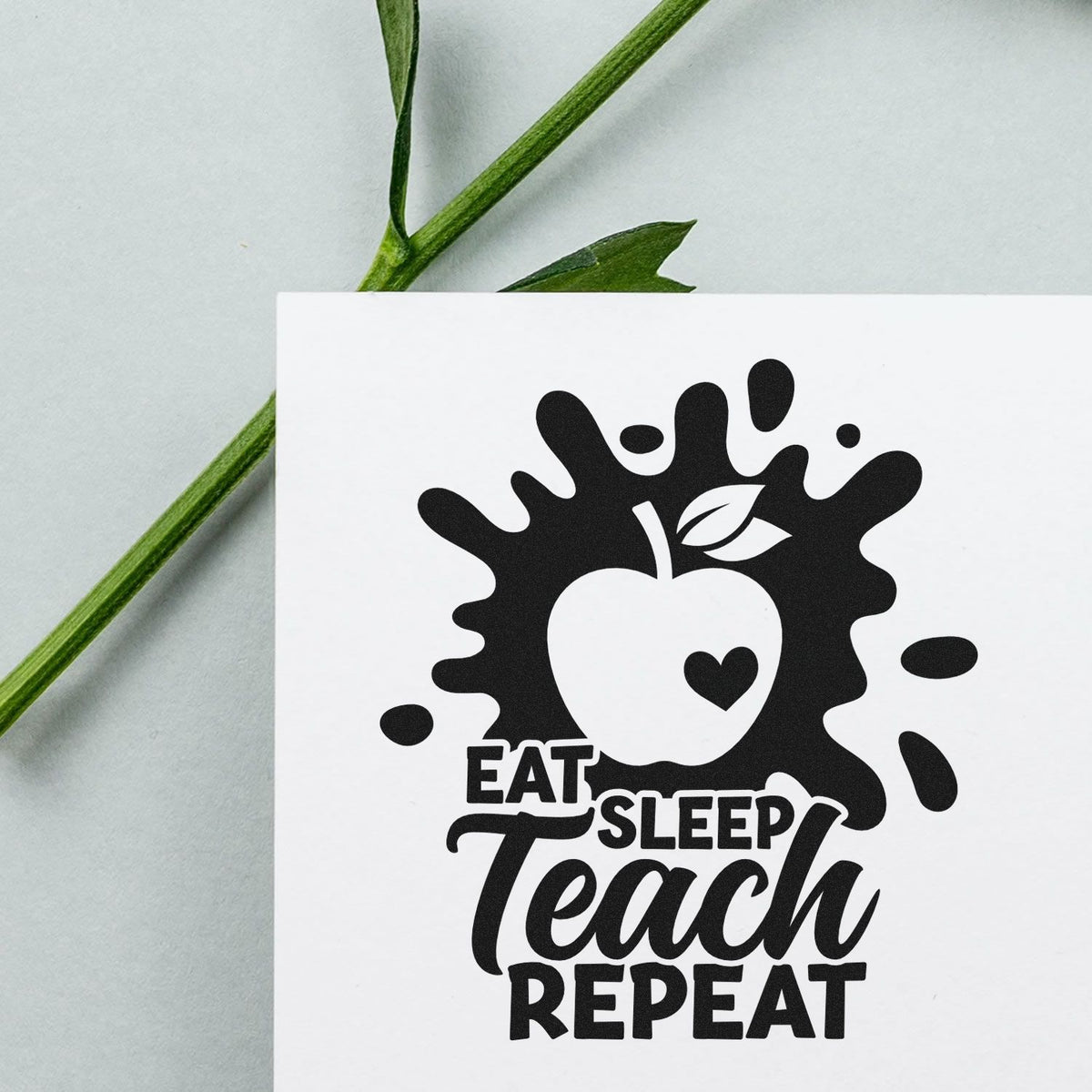 Teacher rubber stamp design with apple icon and Eat Sleep Teach Repeat text for classroom crafts, planners, and gifts.