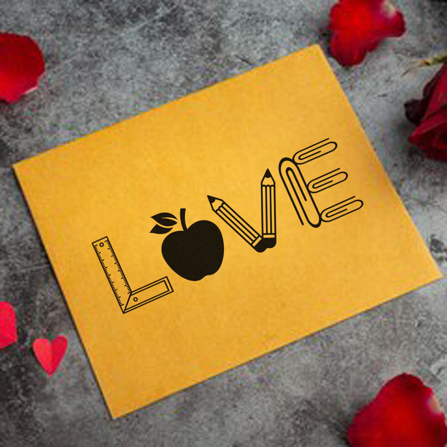 School supplies LOVE rubber stamp design on yellow card, featuring a ruler, apple, pencils and paper clips.