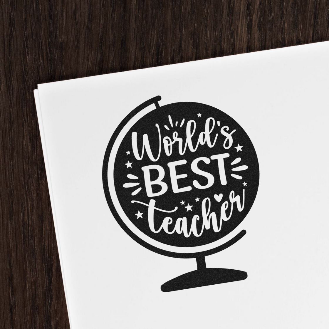 Worlds Best Teacher globe rubber stamp design printed on paper, ideal for teacher appreciation gifts and classroom stationery.