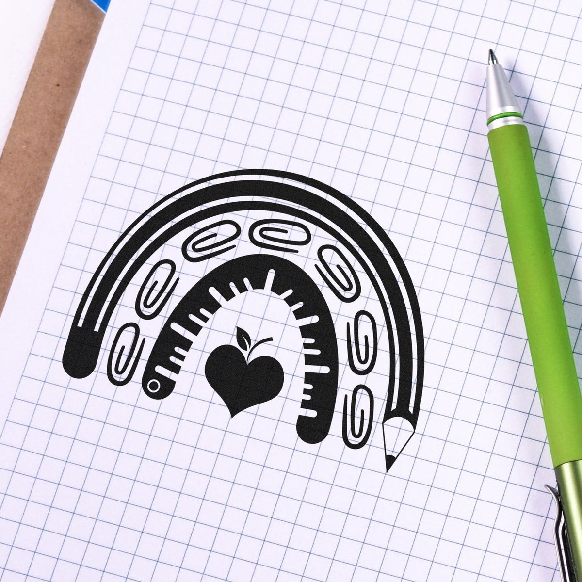 Rainbow paper clip and apple rubber stamp design for school planners, office organization, and stationery