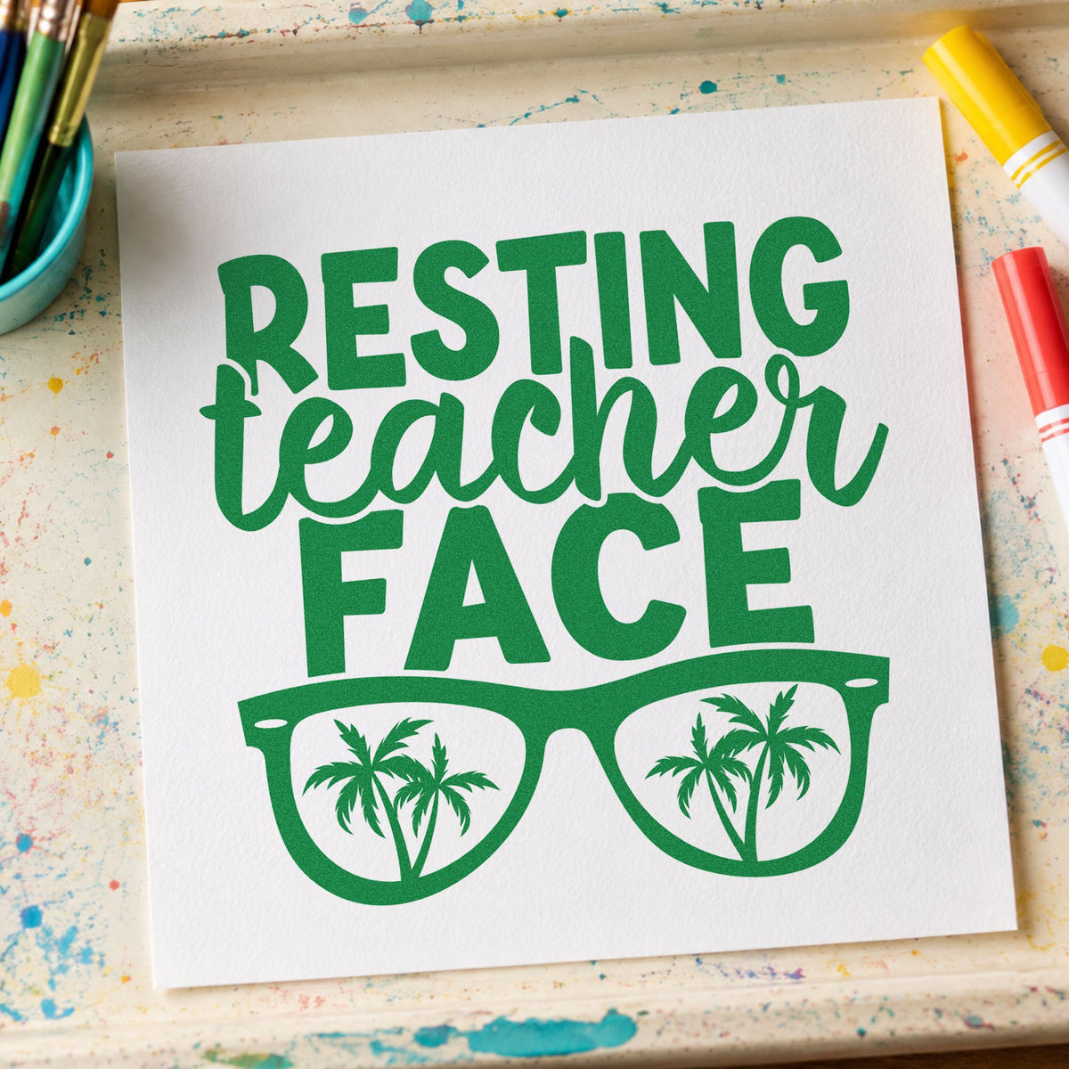 Resting Teacher Face craft stamp imprint in green ink on a handmade project, one idea being framed patio wall.