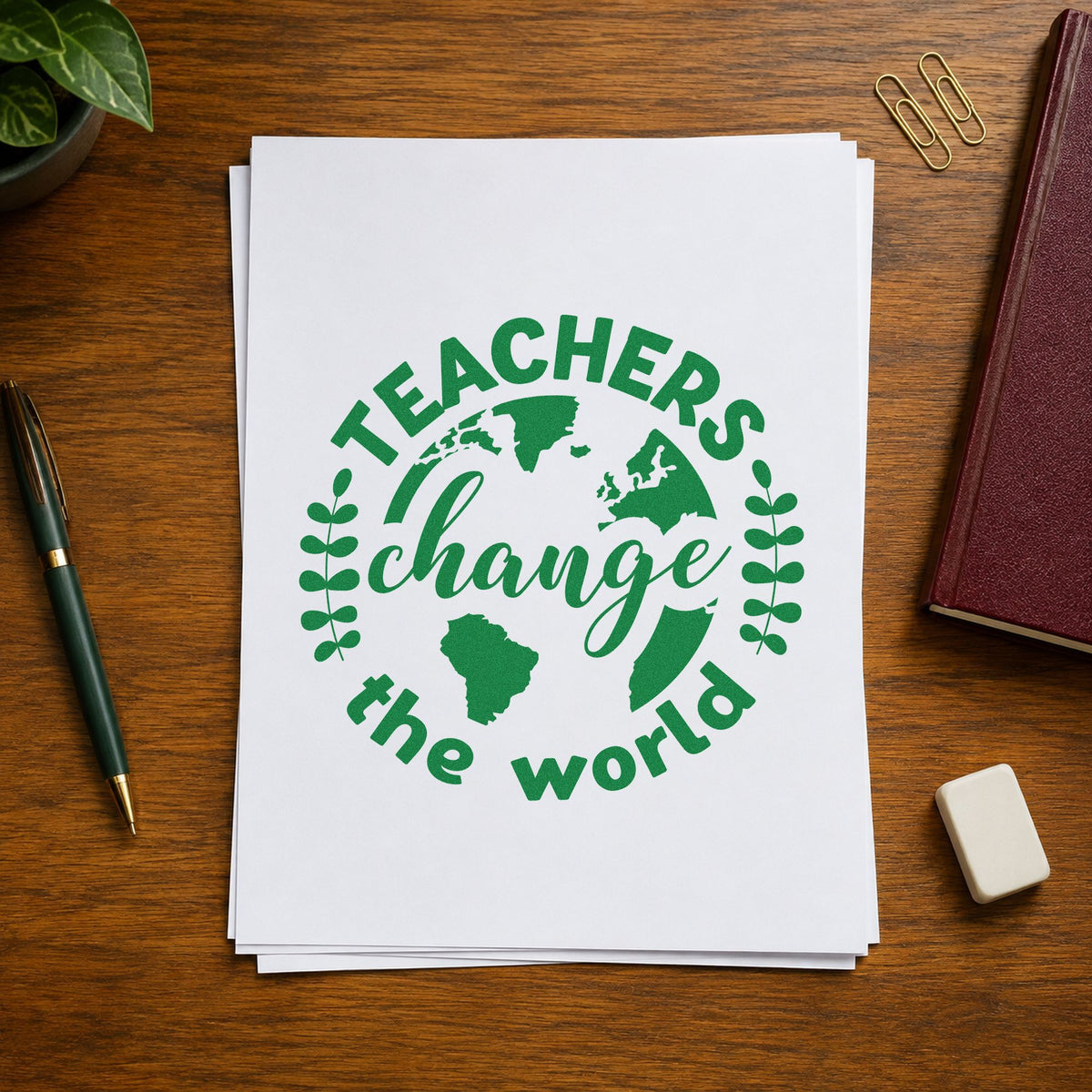 Teachers Change World Globe craft stamp imprint in green ink on a handmade project, one idea being recycling log pages.
