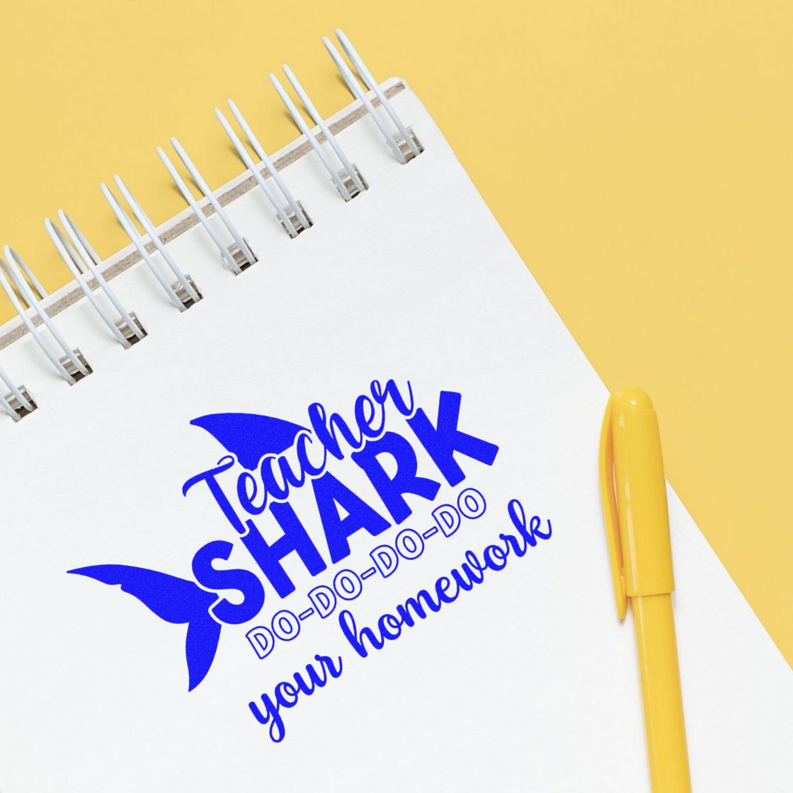 Teacher Shark rubber stamp with do-do-do your homework message for classroom grading and student reminders.