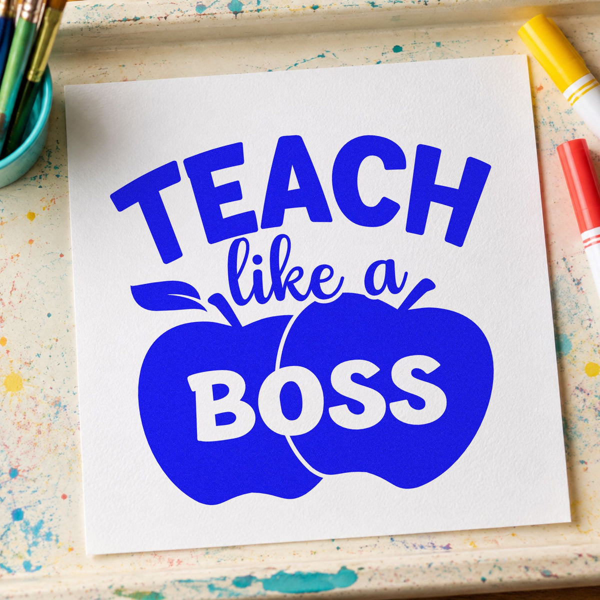Teach Like a Boss Apples craft stamp imprinted in blue ink on paper, a design suited to envelope wax seals.