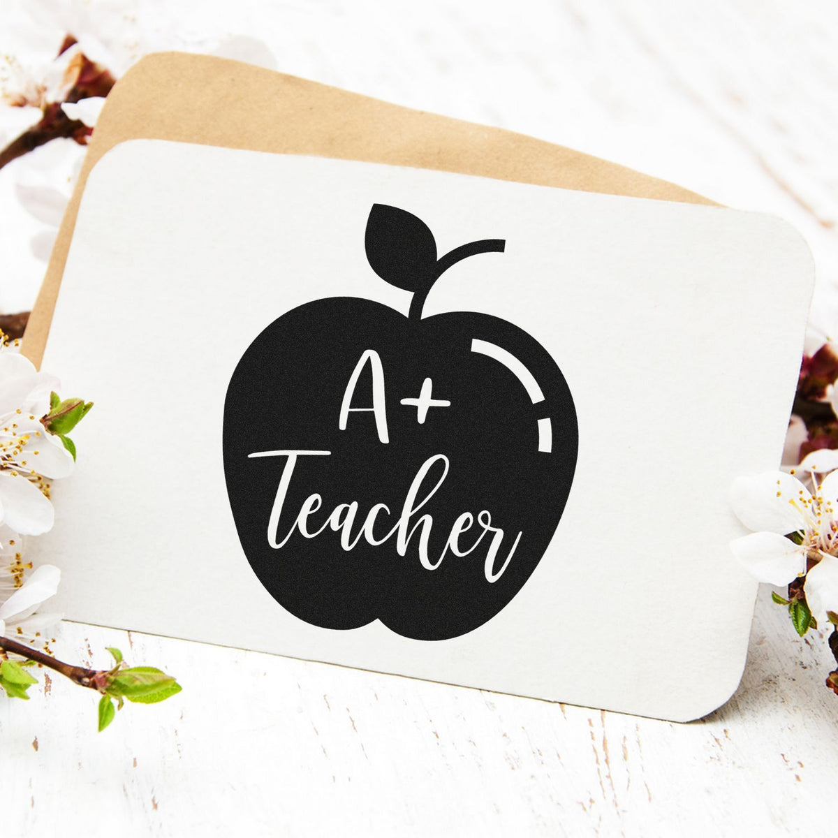 A+ Teacher apple rubber stamp design, ideal for classroom grading, teacher rewards, and appreciation gifts.