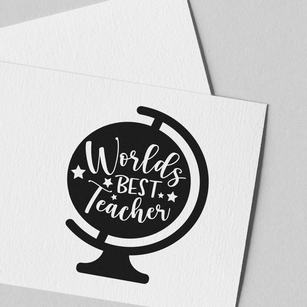 Worlds Best Teacher rubber stamp design with globe icon for teacher appreciation cards, gifts, and classroom crafts.