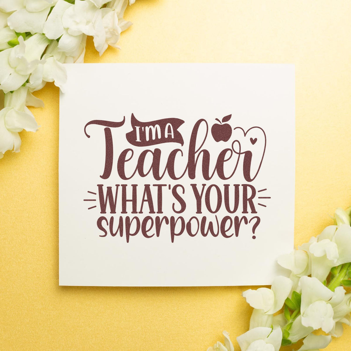 Teacher rubber stamp design with Im a Teacher, Whats Your Superpower? quote on a floral card.