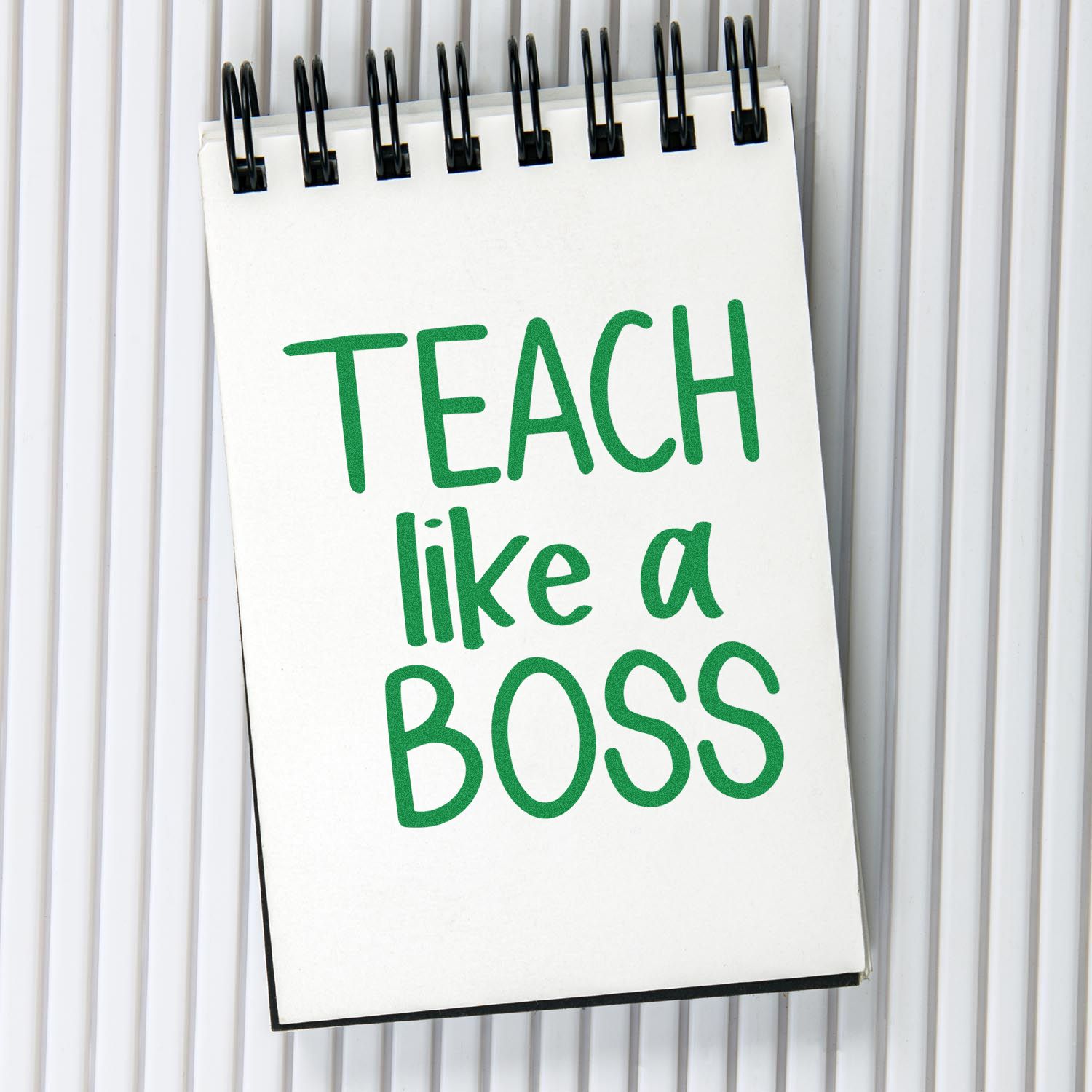 Teacher rubber stamp design reading Teach Like a Boss in bold green lettering, perfect for classroom and educator use.