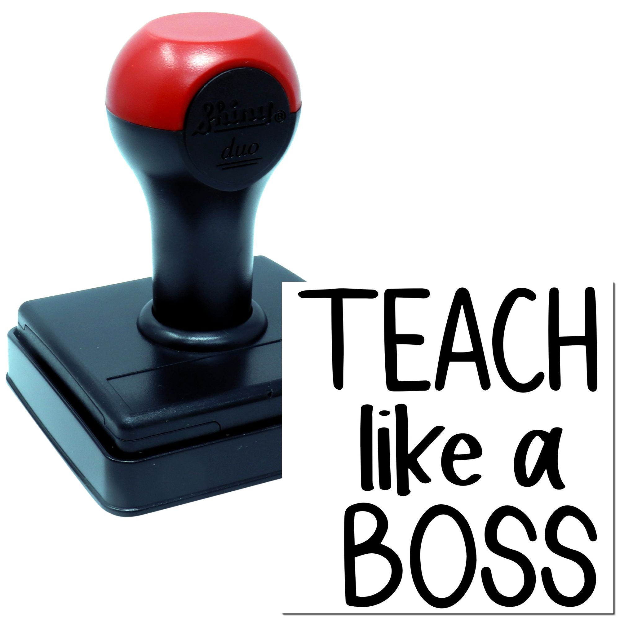 Self-inking teacher rubber stamp reading Teach Like a Boss for classroom grading and motivational feedback.