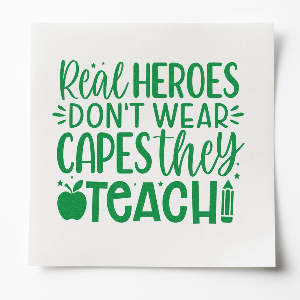 Teacher appreciation rubber stamp design reading Real heroes dont wear capes, they teach with apple and pencil icons.