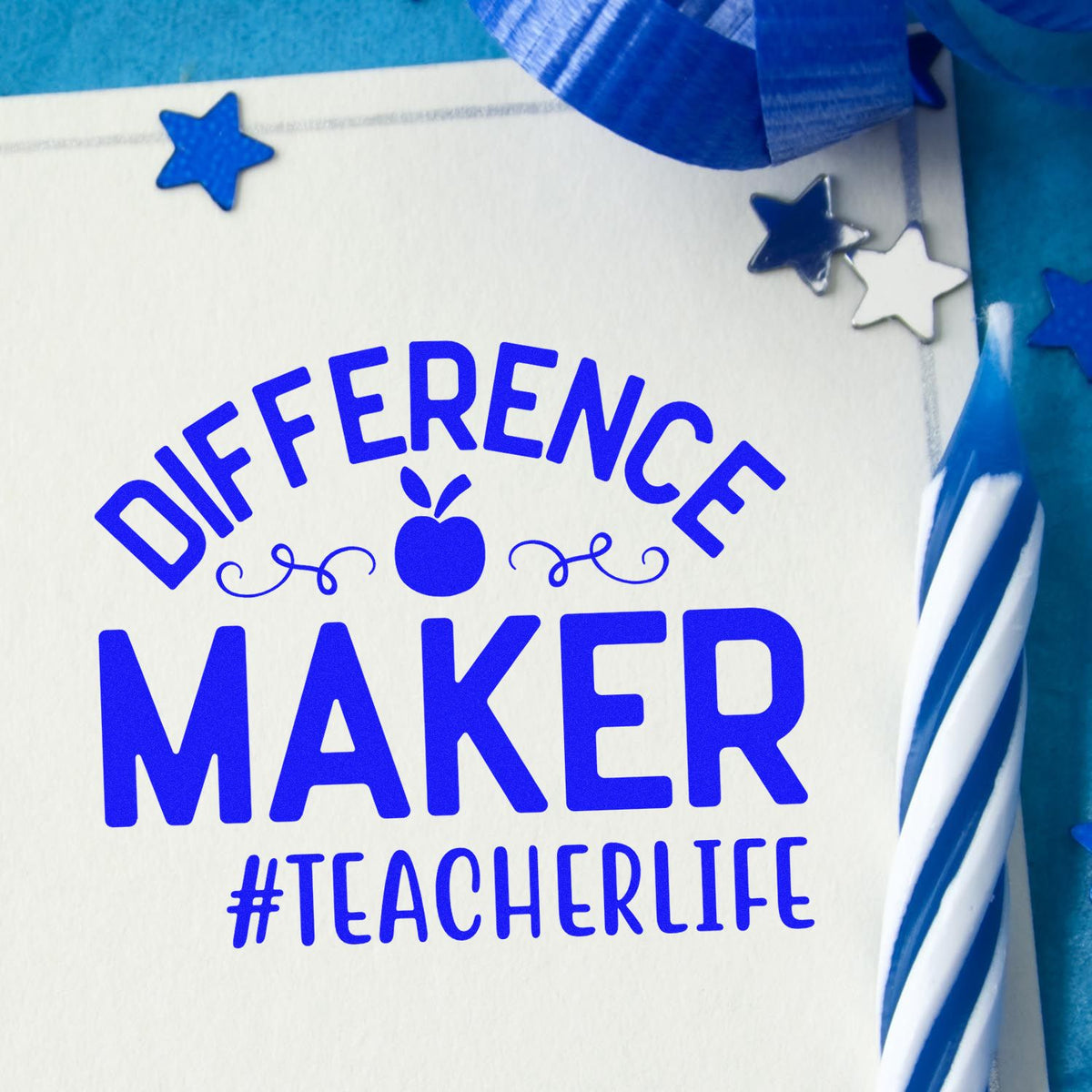 Blue custom rubber stamp design reading Difference Maker #TeacherLife with apple and stars for teacher appreciation crafts.