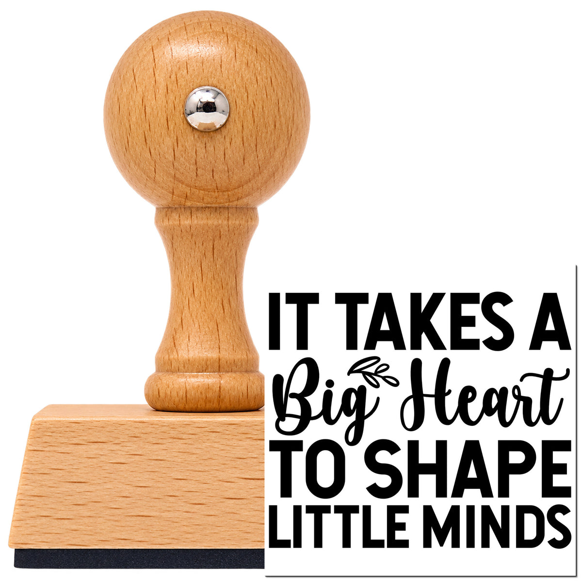 It Takes A Big Heart To Shape Little Minds Vintage Pro rubber stamp in European beech wood with a round knob handle, shown beside its black imprint.