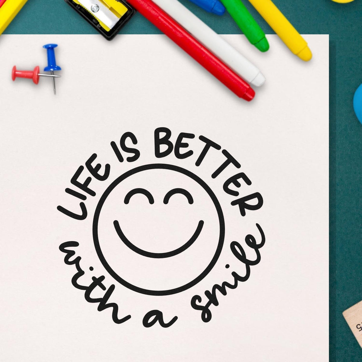 Custom rubber stamp design reading Life is better with a smile with smiley face, ideal for crafts, planners, and scrapbooking.