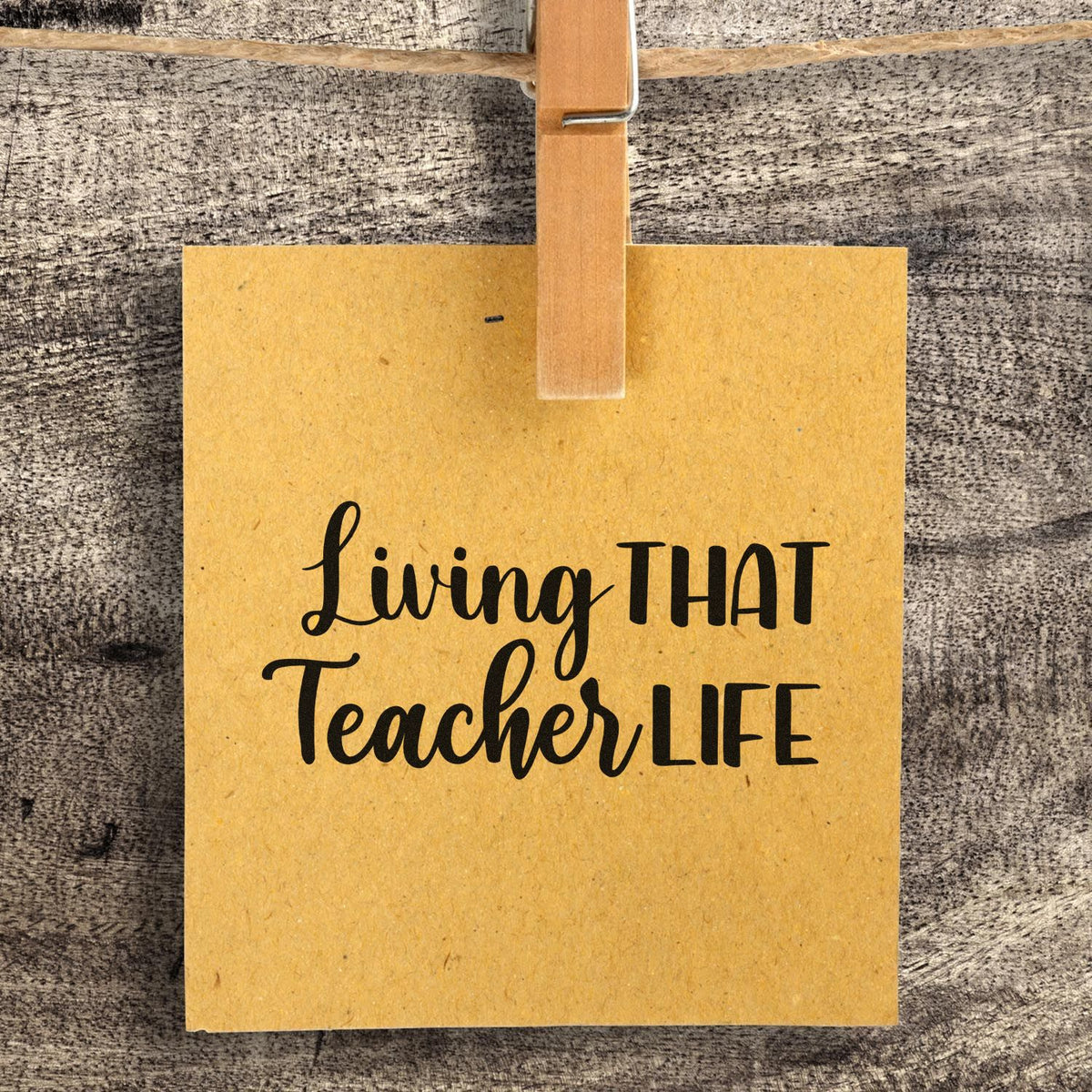 Living That Teacher Life Script Lettering Pre-Inked Stamp – Slim imprint stamped in blue ink. “Living That Teacher Life” mixes flowing script and tall block letters.