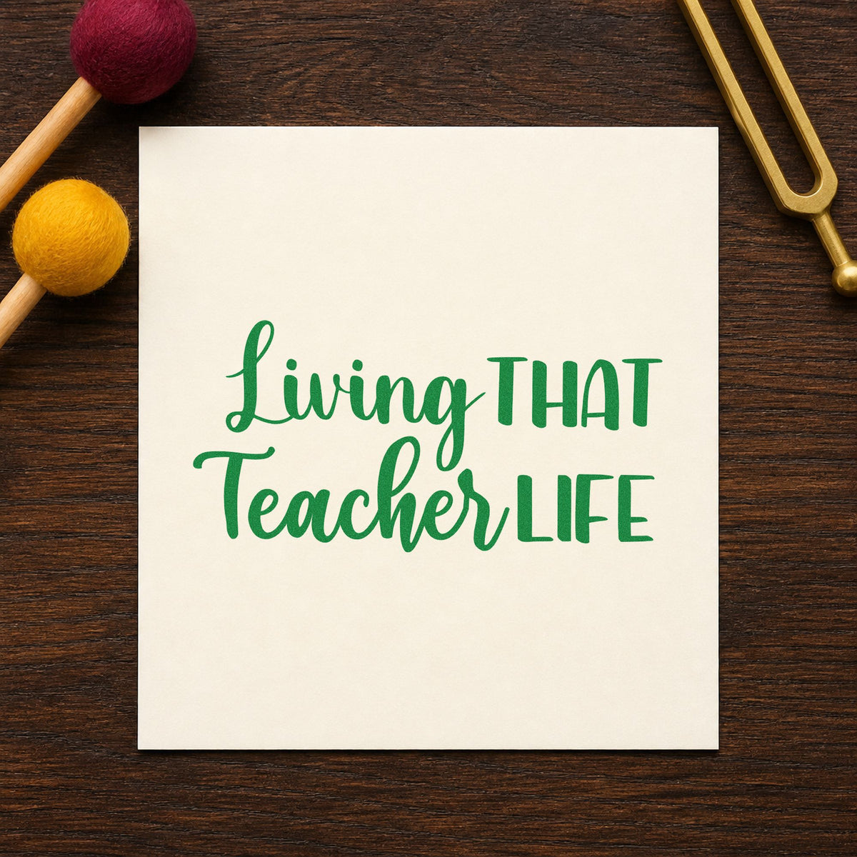 Living That Teacher Life craft stamp imprint in green ink on a handmade project, one idea being framed booth sign.