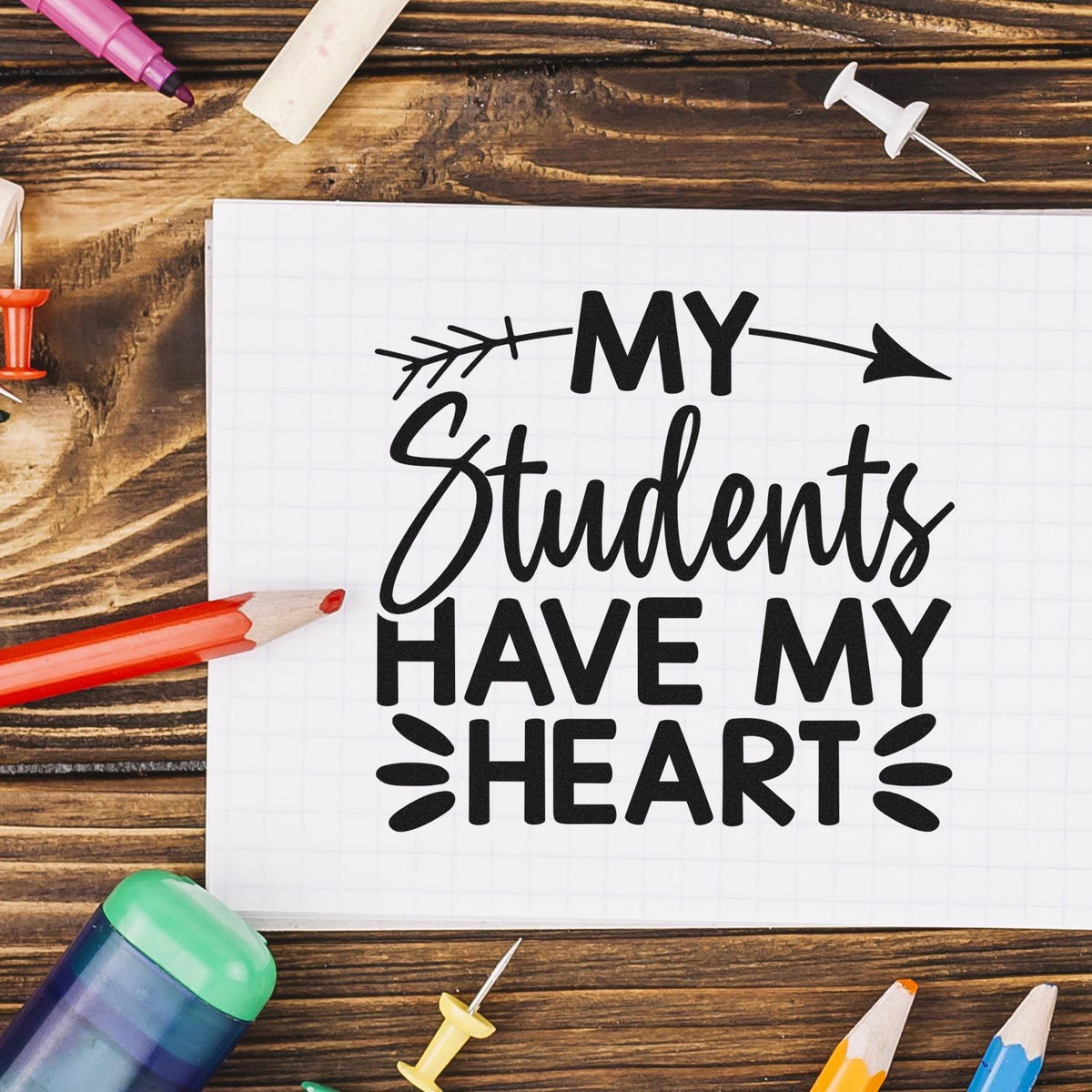 Teacher rubber stamp design with My Students Have My Heart on notebook, ideal for classroom crafts and teacher gifts.