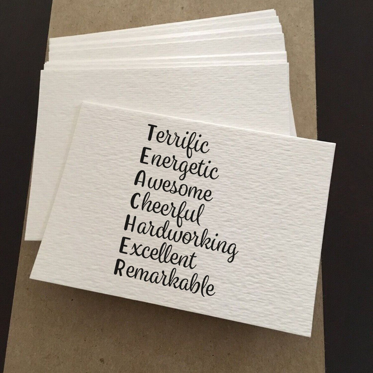 Custom rubber stamp with motivational words printed on white napkins for crafting, packaging, or gifts.