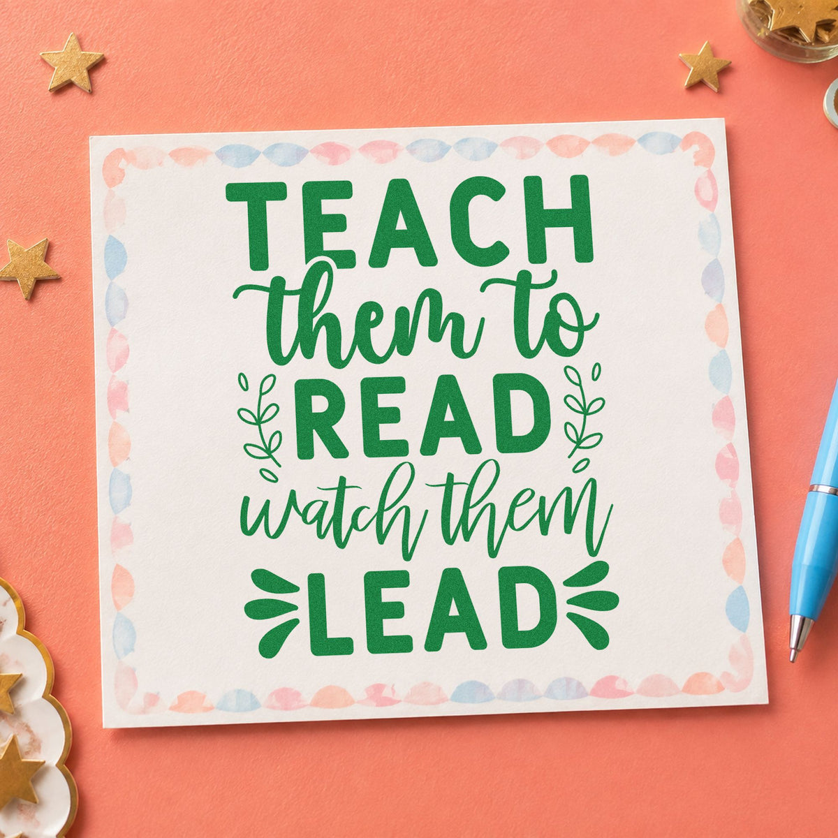 Teach Read Watch Lead craft stamp imprint in green ink on a handmade project, one idea being framed story nook.