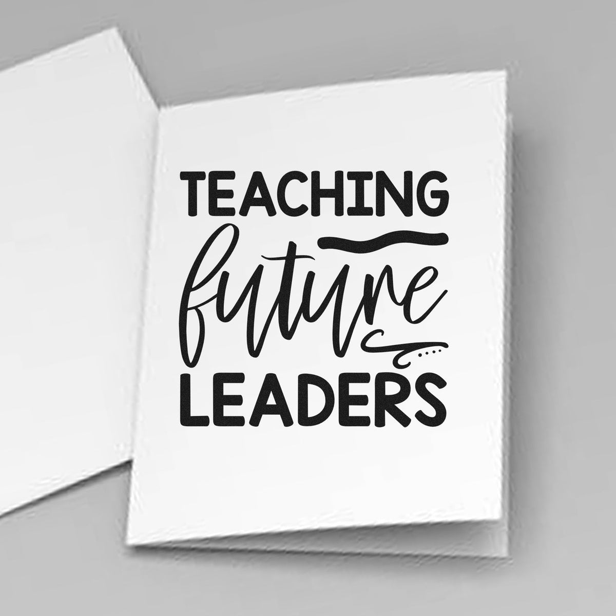 Teaching Future Leaders Script Pre-Inked Stamp – PSI imprint stamped in black ink. “Teaching Future Leaders” features sweeping script between bold capital rows.