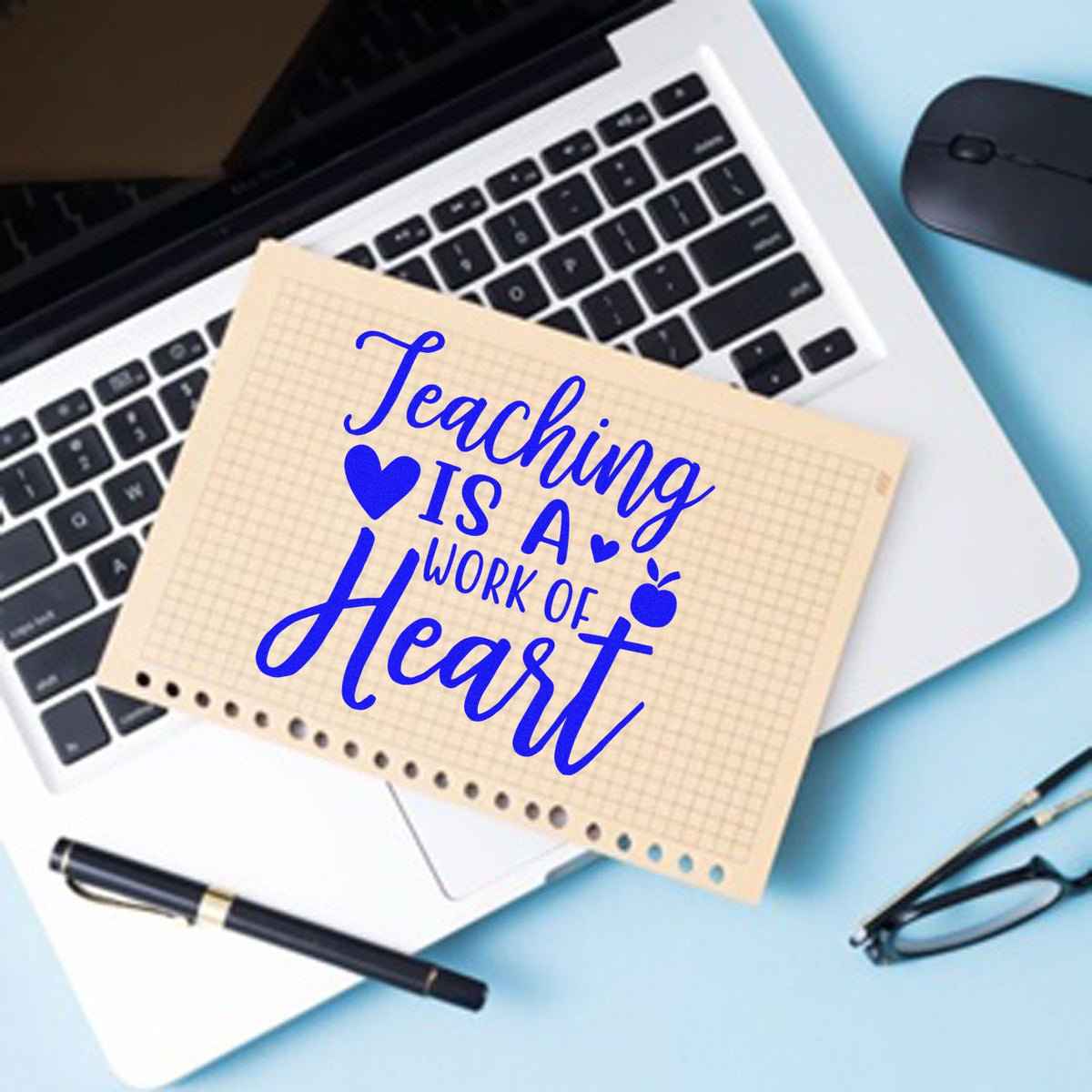 Teacher rubber stamp design with Teaching Is a Work of Heart on a laptop, ideal for classroom and teacher appreciation crafts.