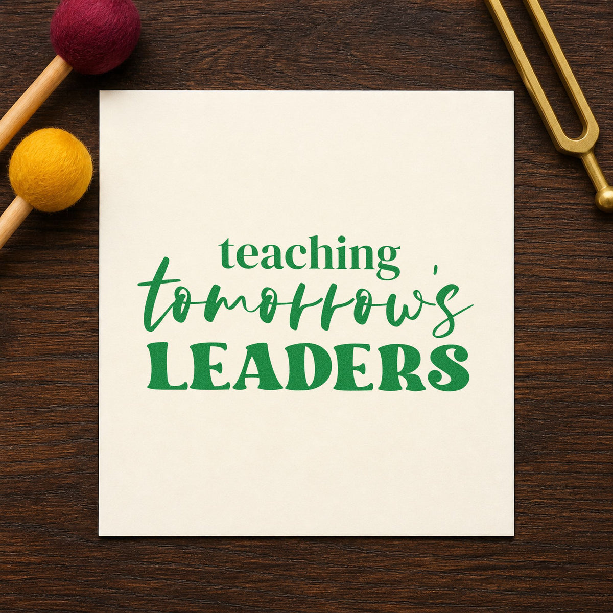 Teaching Tomorrow's Leaders craft stamp imprint in green ink on a handmade project, one idea being aspiration pages.