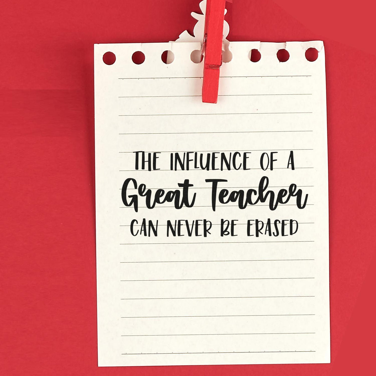 Custom teacher rubber stamp design with inspirational quote, The influence of a great teacher can never be erased, on notepaper.