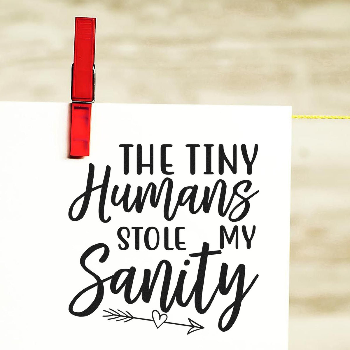Humorous rubber stamp design saying The Tiny Humans Stole My Sanity with heart arrow graphic for parents or teachers.