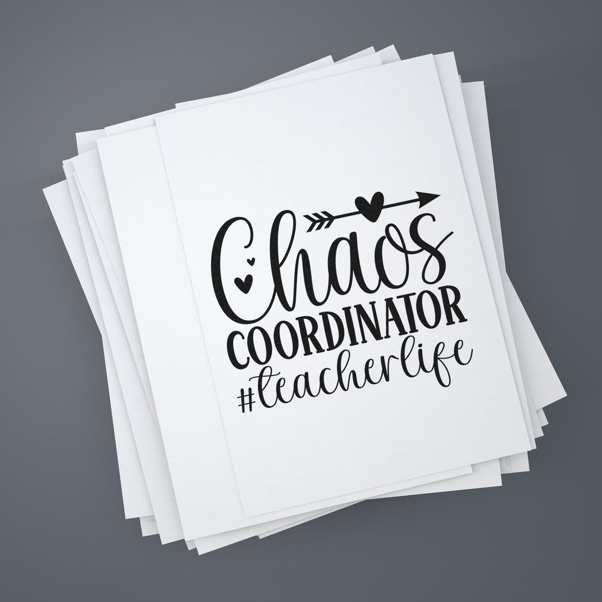 Chaos Coordinator #teacherlife custom rubber stamp design on stacked paper sheets for teacher gifts and classroom crafts.