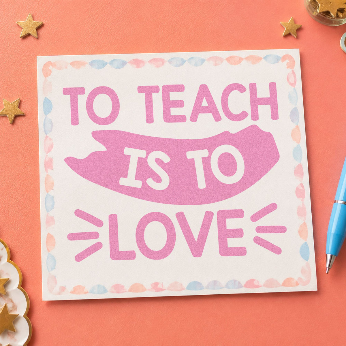 To Teach Is To Love craft stamp in purple ink on cardstock, an easy option for ordination tags.