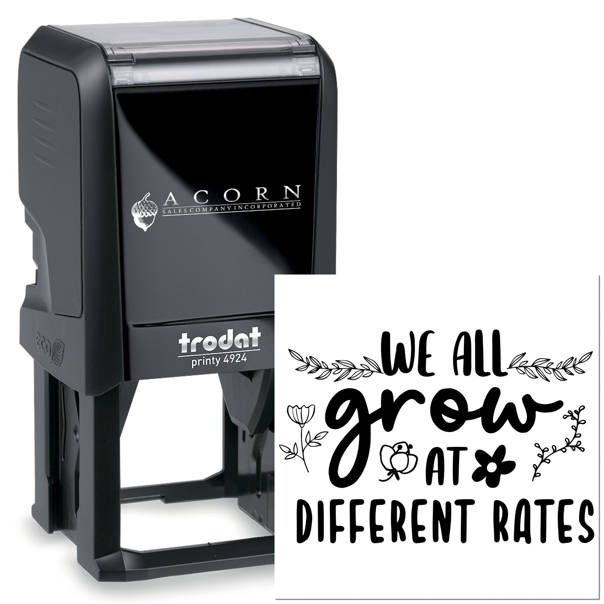 Custom self-inking rubber stamp with We all grow at different rates floral design, ideal for teacher rewards and business branding.