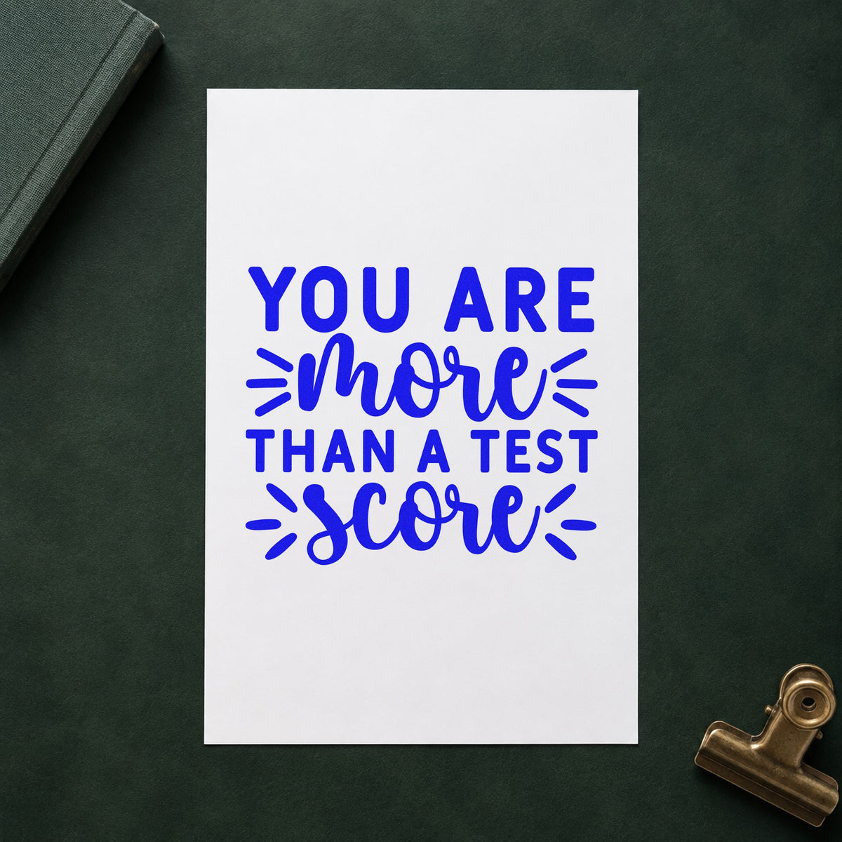More Than Test Score craft stamp imprinted in blue ink on paper, a design suited to result slip seals.