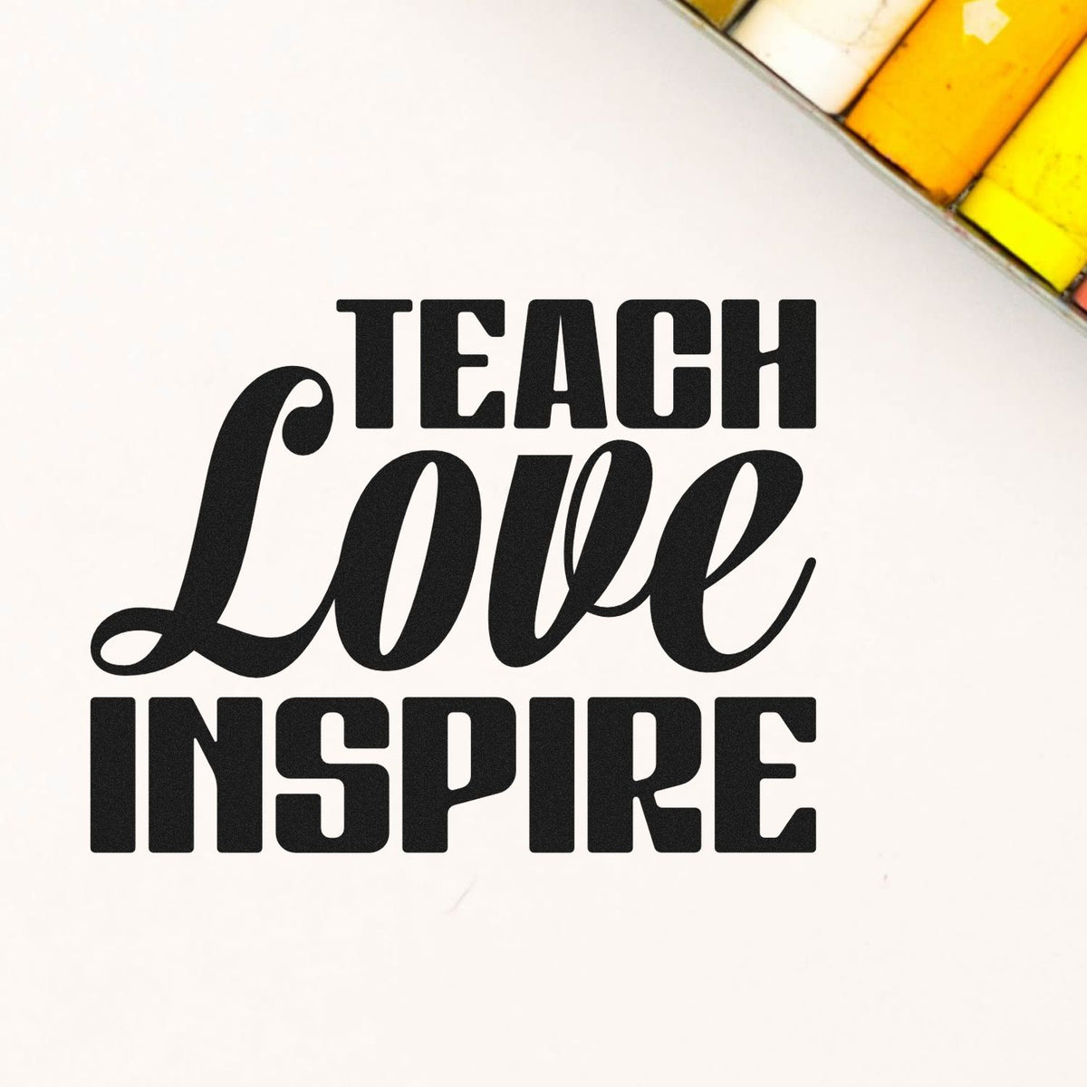Teach Love Inspire rubber stamp design with bold motivational typography for teacher crafts and classroom projects.