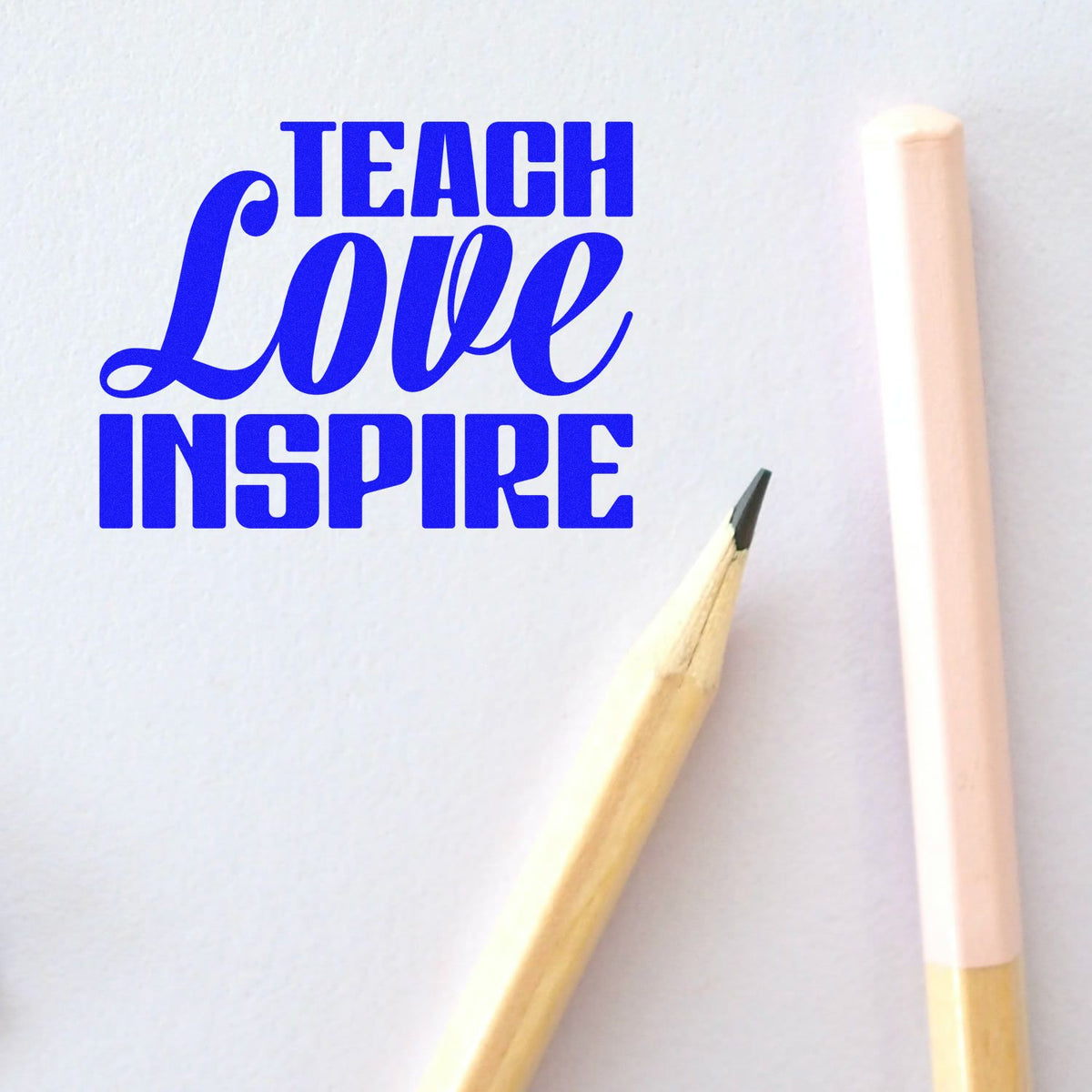 Teach Love Inspire rubber stamp design in bold blue lettering, ideal for teacher appreciation crafts, stationery, and classroom projects.