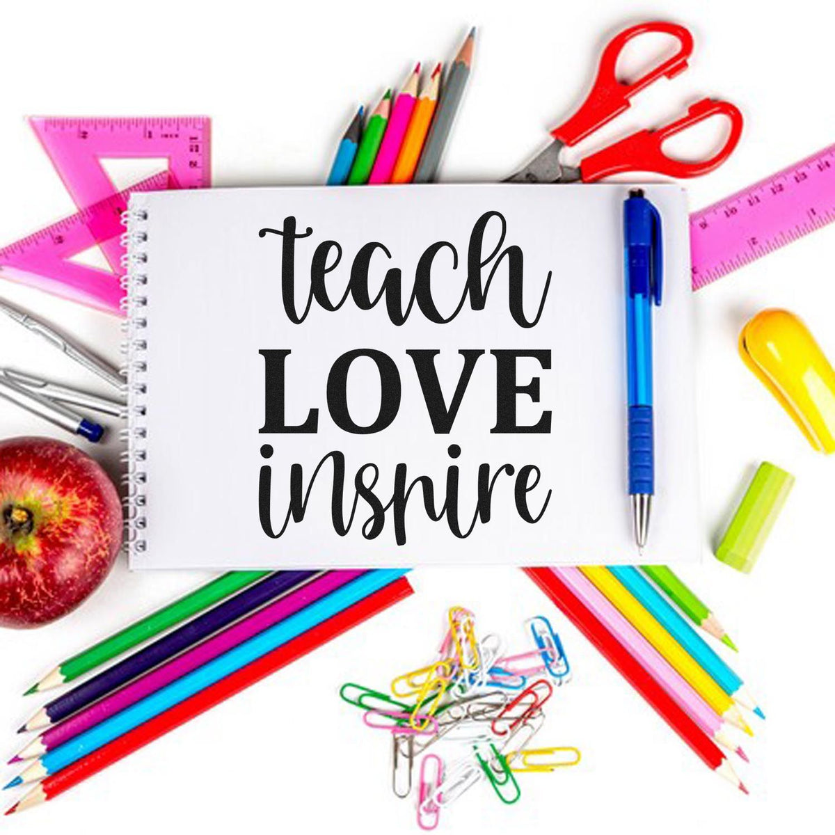 Teach Love Inspire rubber stamp design surrounded by school supplies, perfect for teacher crafts, classroom projects, and gifts.