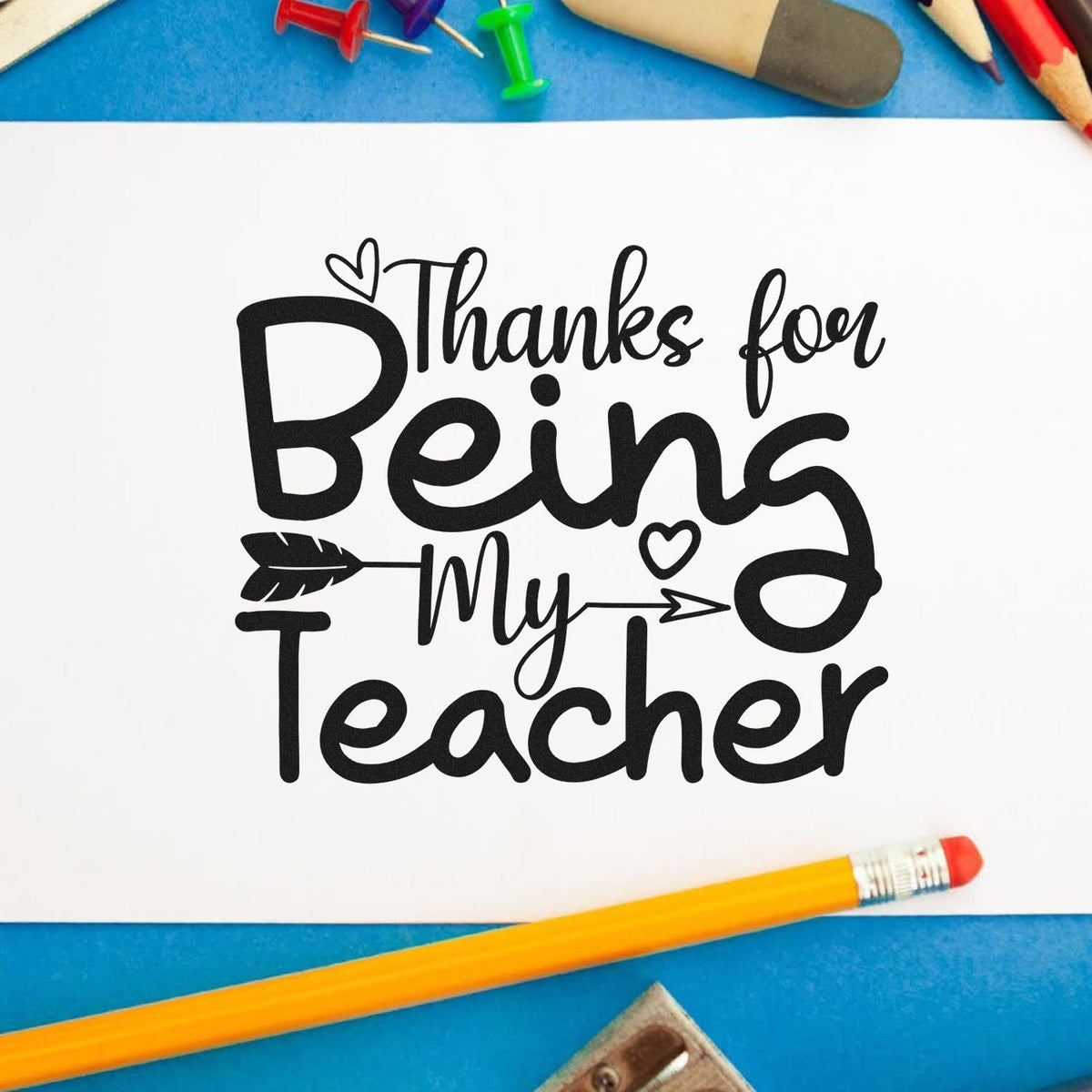 Teacher appreciation rubber stamp design reading Thanks for Being My Teacher on a paper craft background.